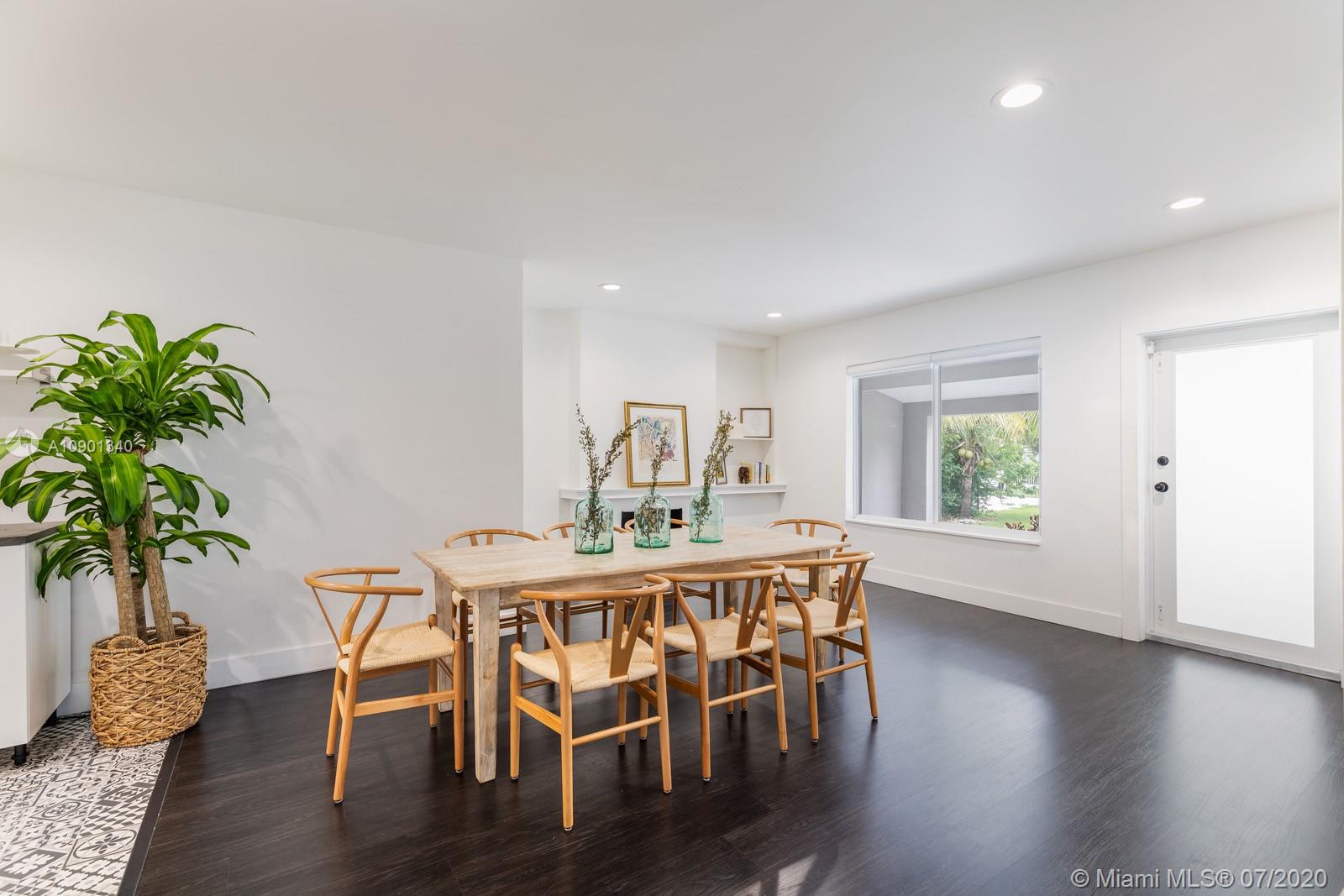 6070 Southwest 25th Street Miami, FL 33155 - Photo 2 of 15 a view of a dining room with furniture and wooden floor