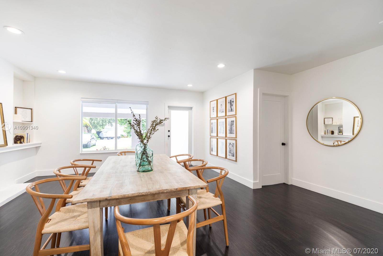 6070 Southwest 25th Street Miami, FL 33155 - Photo 3 of 15 a view of a dining room with furniture and wooden floor