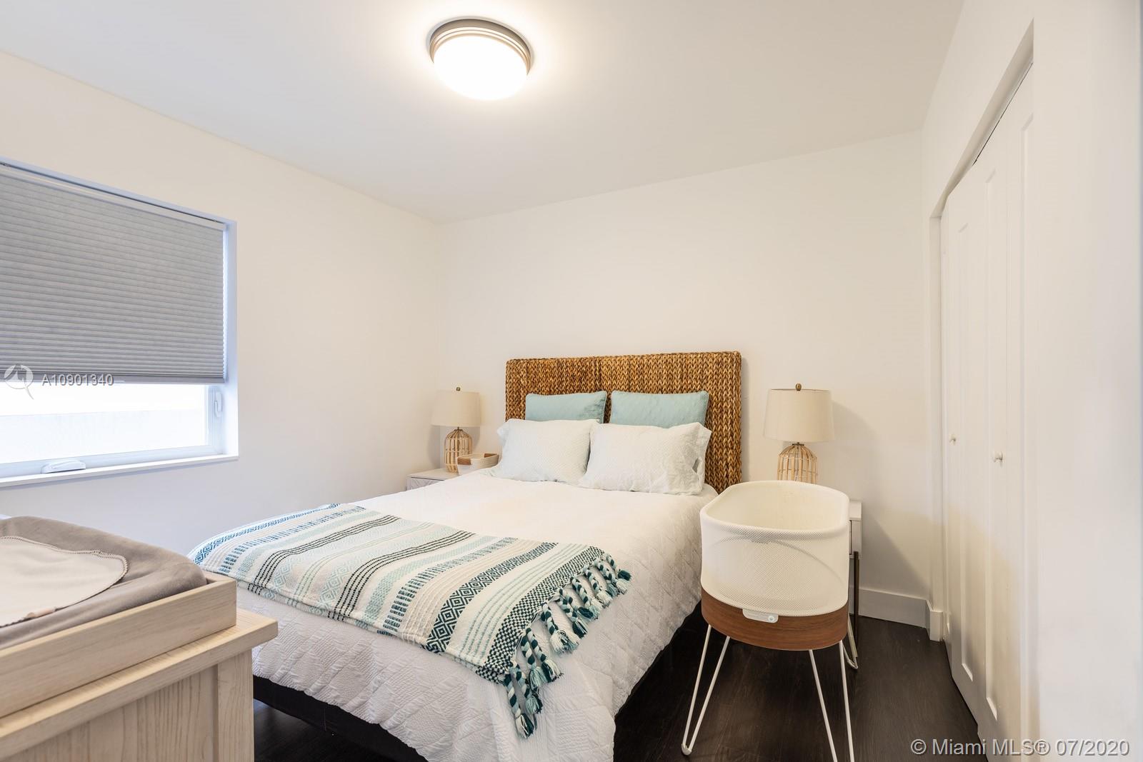 6070 Southwest 25th Street Miami, FL 33155 - Photo 5 of 15 a bedroom with a bed and a window