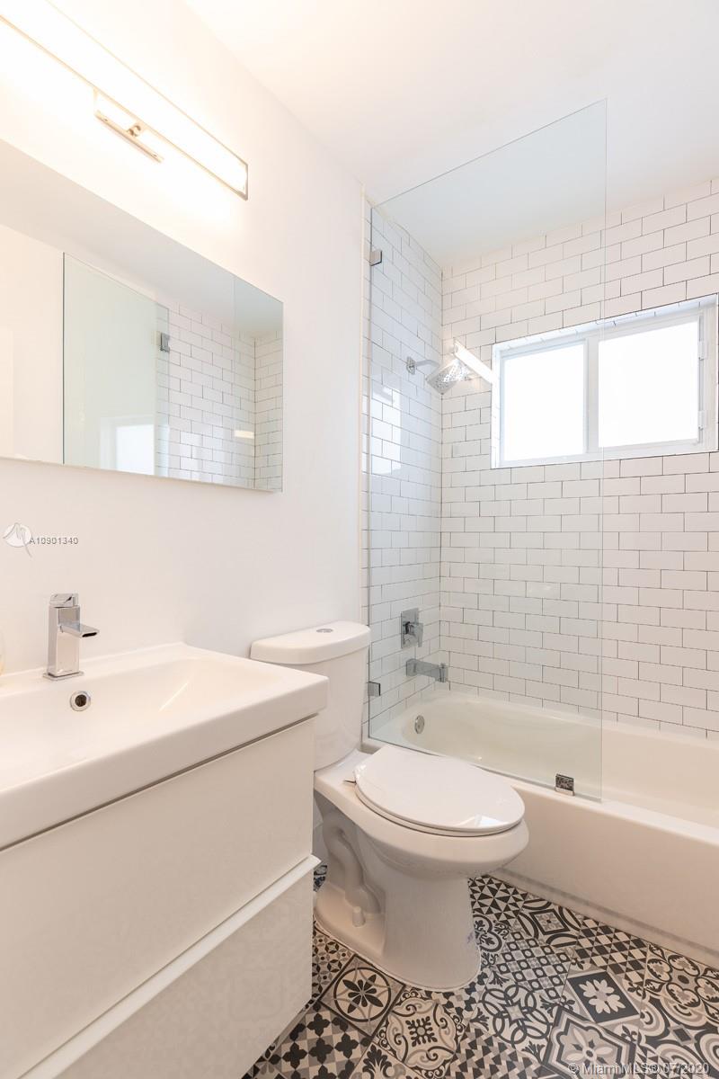 6070 Southwest 25th Street Miami, FL 33155 - Photo 6 of 15 a bathroom with a bathtub shower sink mirror and toilet
