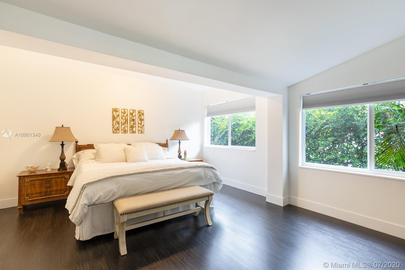 6070 Southwest 25th Street Miami, FL 33155 - Photo 7 of 15 a bed room with a bed and a large window