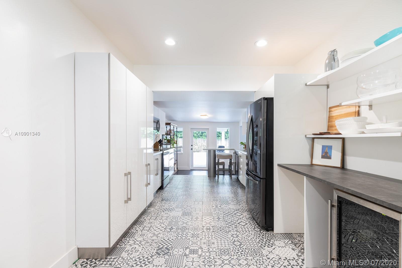 6070 Southwest 25th Street Miami, FL 33155 - Photo 8 of 15 a view of a kitchen with refrigerator and windows