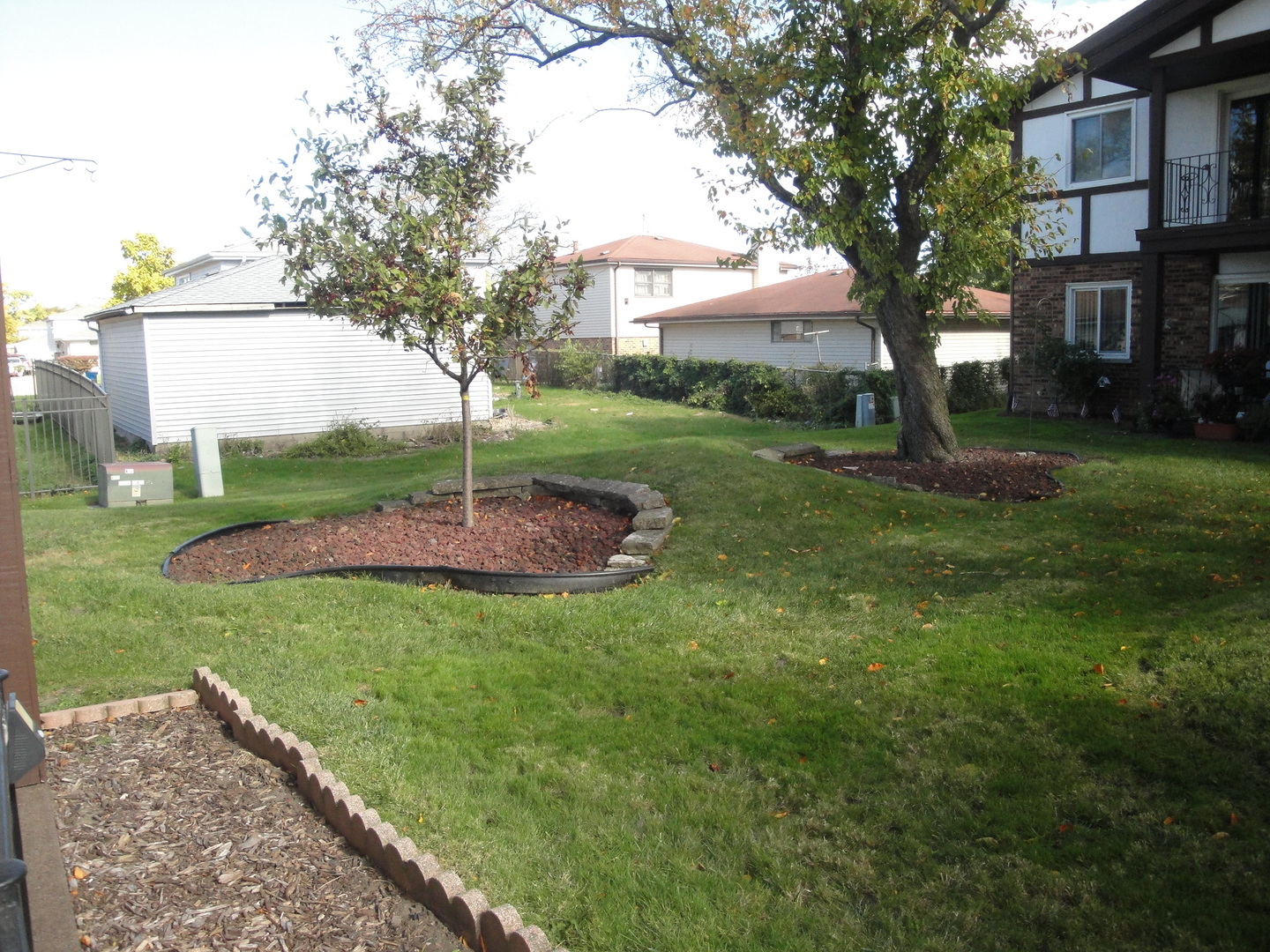 5008 West 122nd Street, Unit 1A Alsip, IL 60803 - Photo 28 of 28 a view of a backyard with a garden and trees