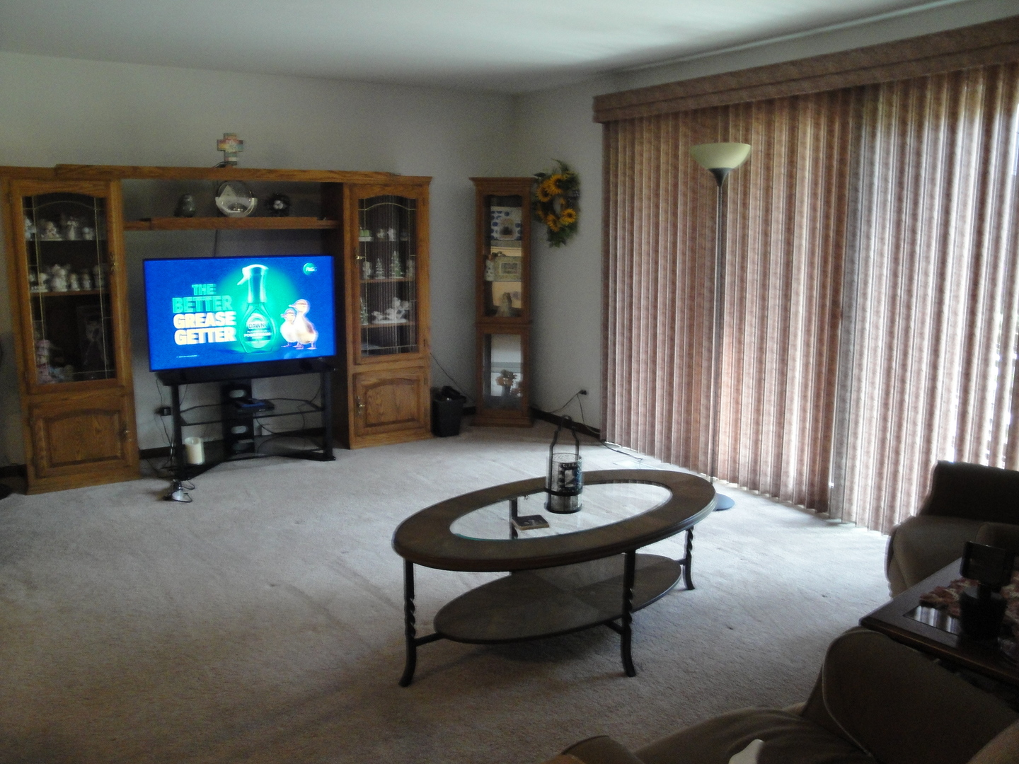 5008 West 122nd Street, Unit 1A Alsip, IL 60803 - Photo 4 of 28 a living room with furniture and a flat screen tv