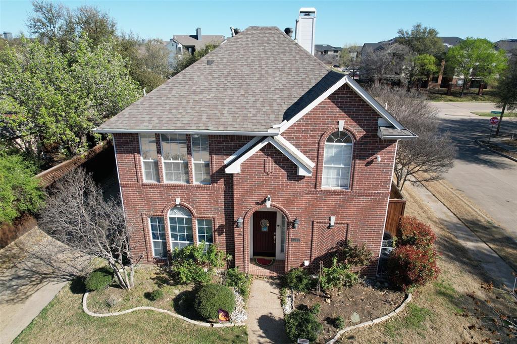 211 Moss Hill Road Irving, TX 75063 - Photo 1 of 14 View of front facade with brick siding, a chimney, and a shingled roof
