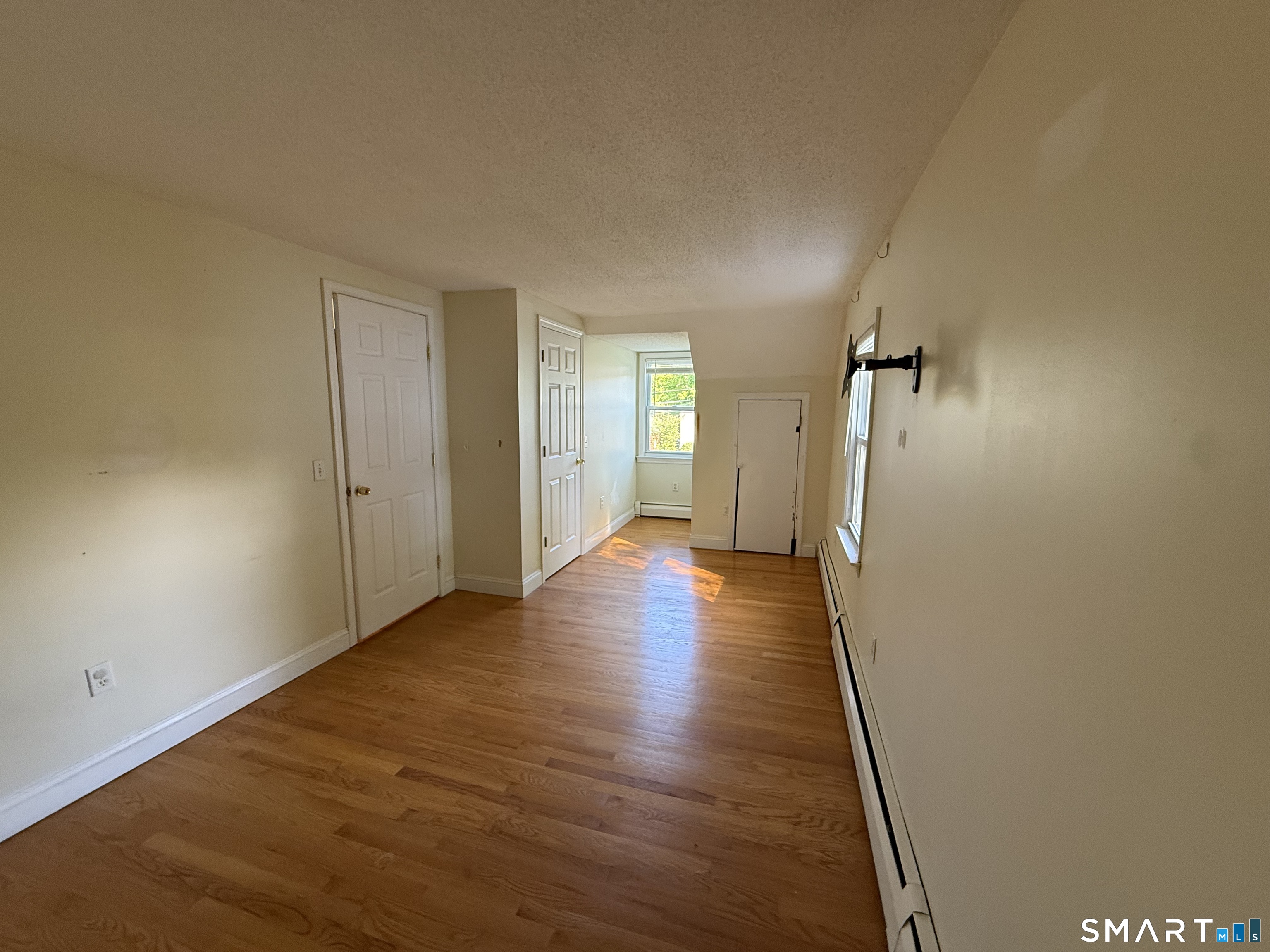 808 East Main Street Torrington, CT 06790 - Photo 36 of 40 a view of a hallway with wooden floor