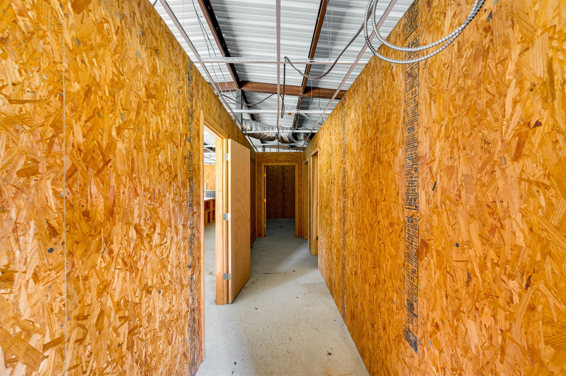 531 County Road 3501 Cuney, TX 75759 - Photo 29 of 35 a view of a hallway with wooden walls and painted walls