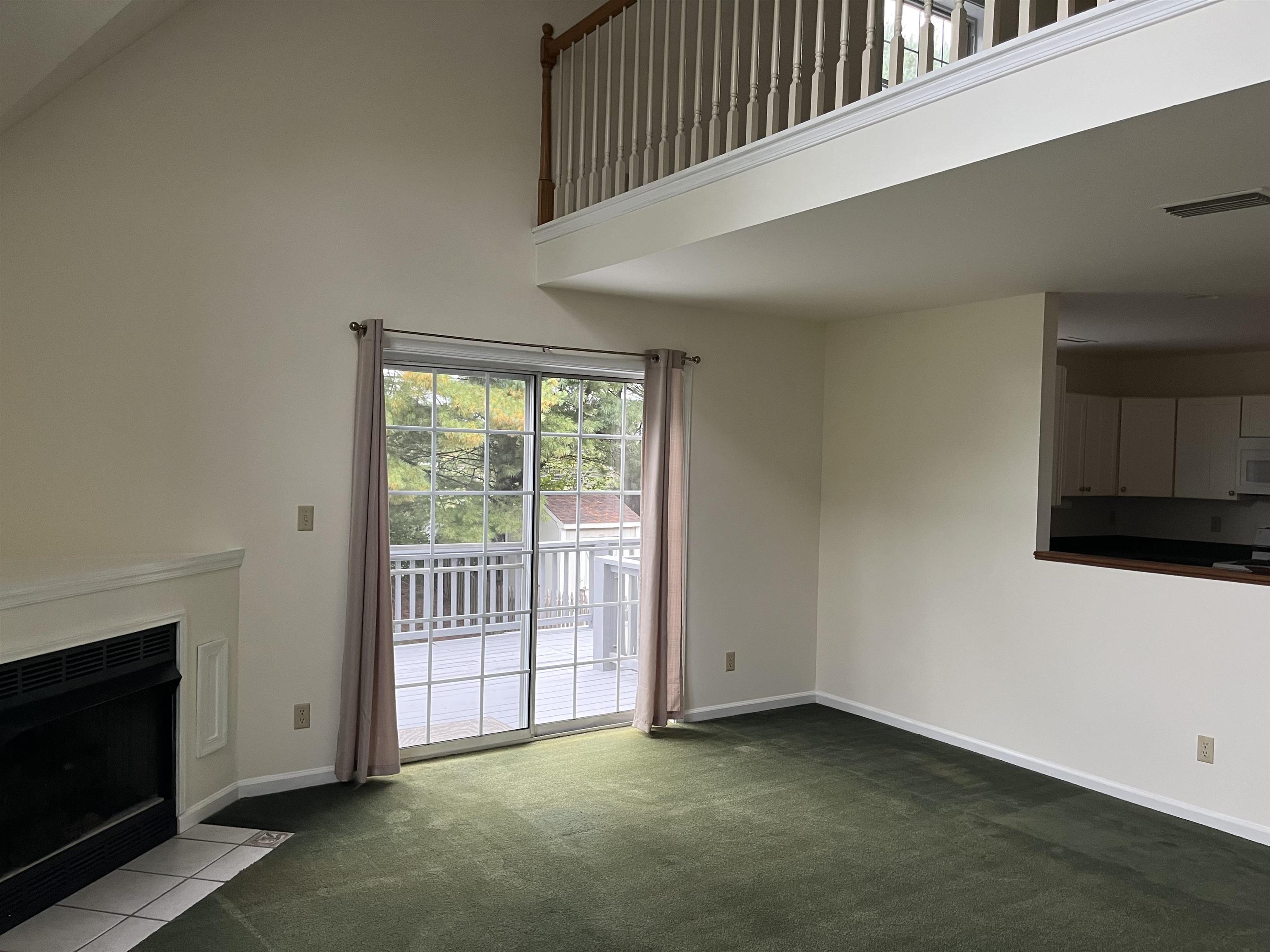 1235 Clover Ridge Place Charlottesville, VA 22901 - Photo 5 of 18 a view of a livingroom with an empty space and a fireplace