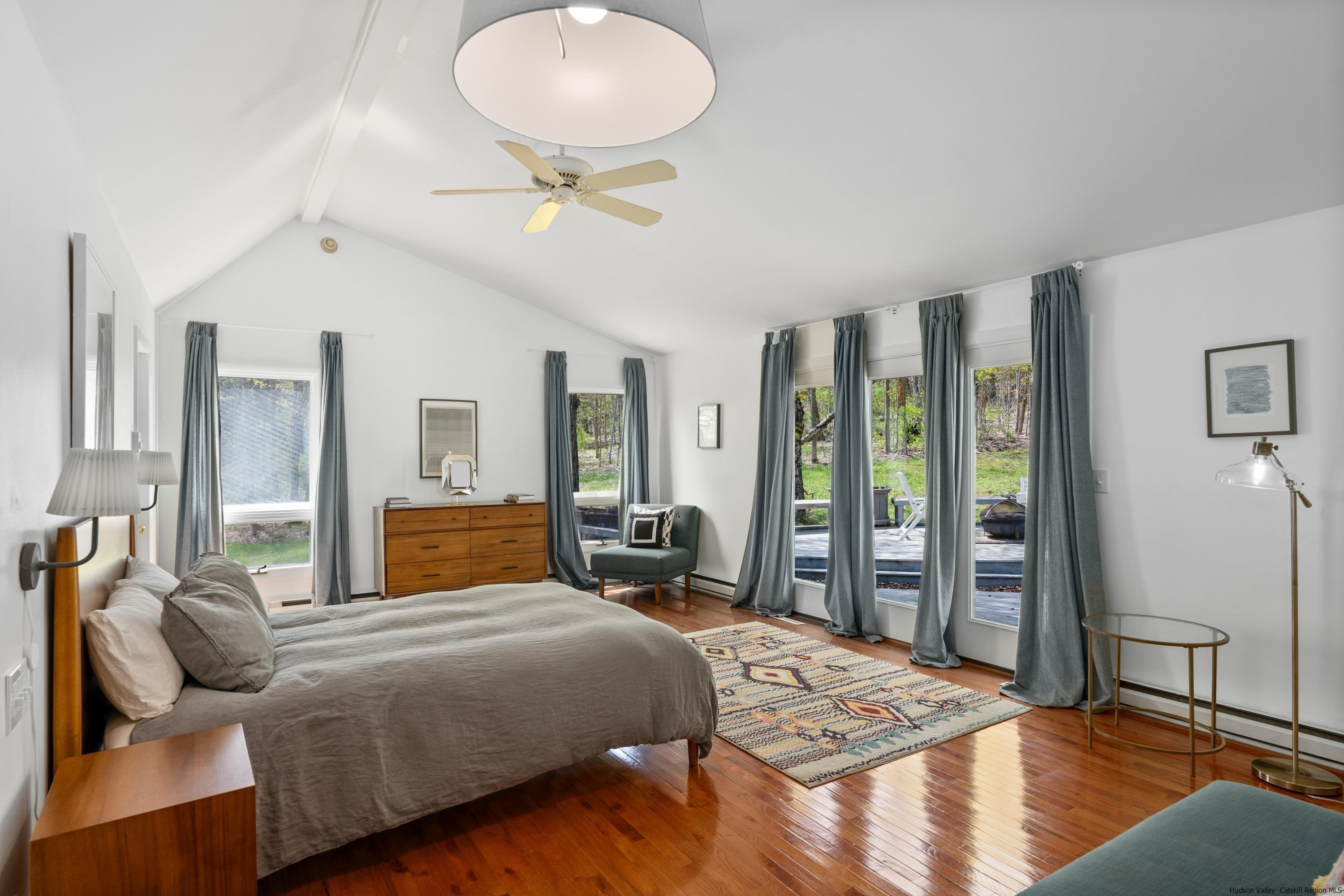 167 Old Towne Road Roxbury, NY 12421 - Photo 13 of 29 a bedroom with a large bed and wooden floor