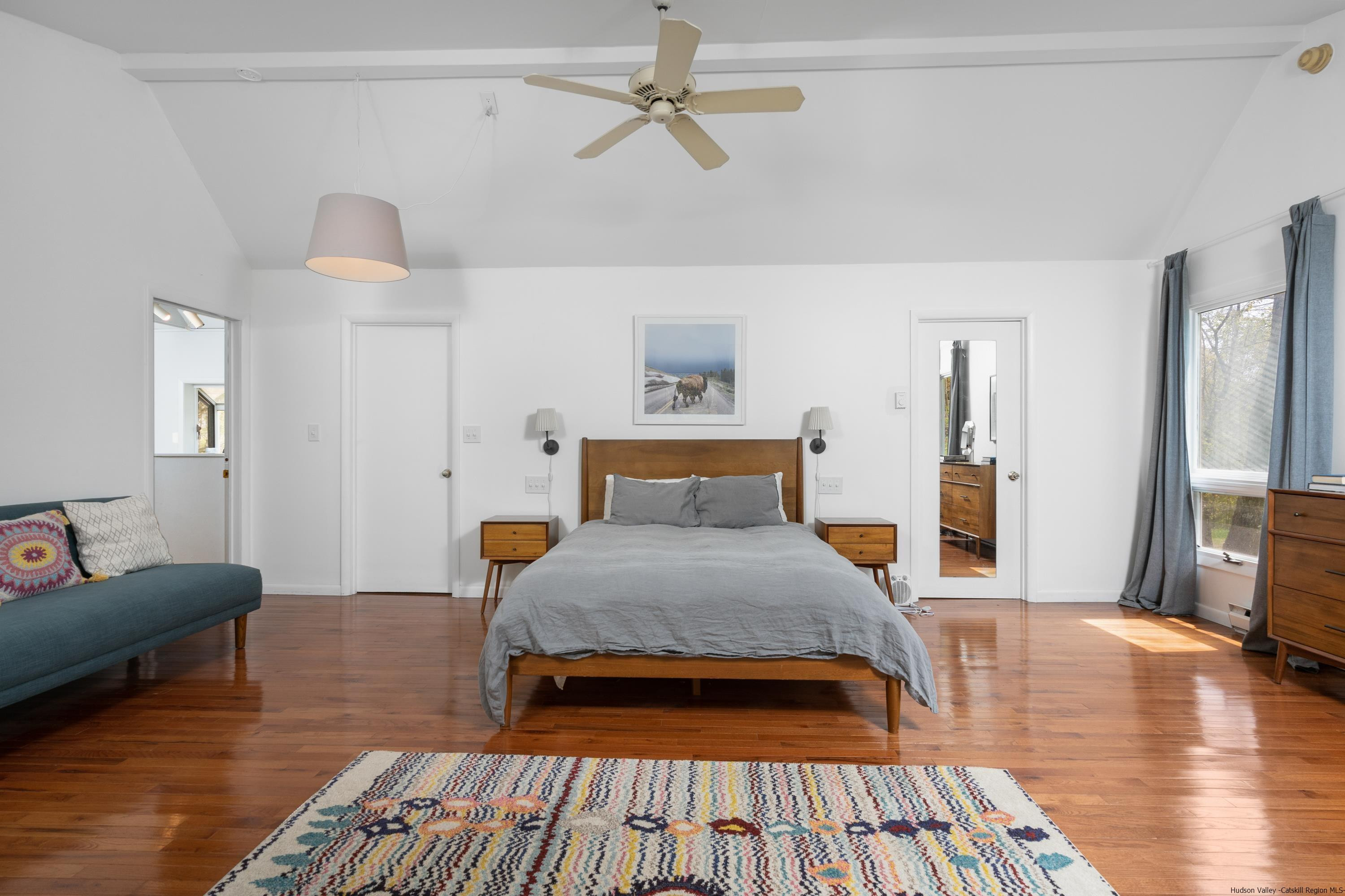 167 Old Towne Road Roxbury, NY 12421 - Photo 14 of 29 a spacious bedroom with a bed and wooden floor