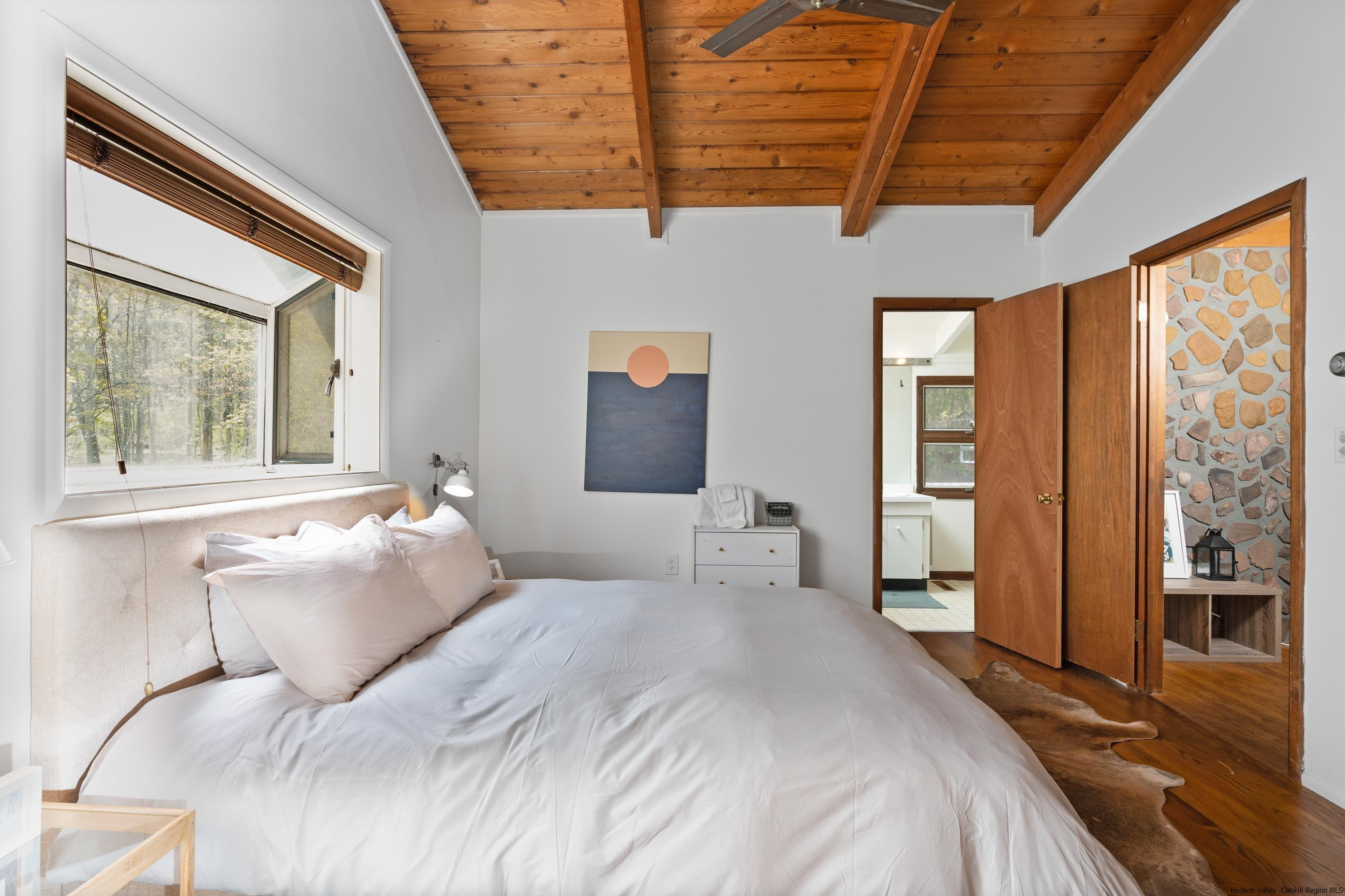 167 Old Towne Road Roxbury, NY 12421 - Photo 20 of 29 a bedroom with a large bed and a large window