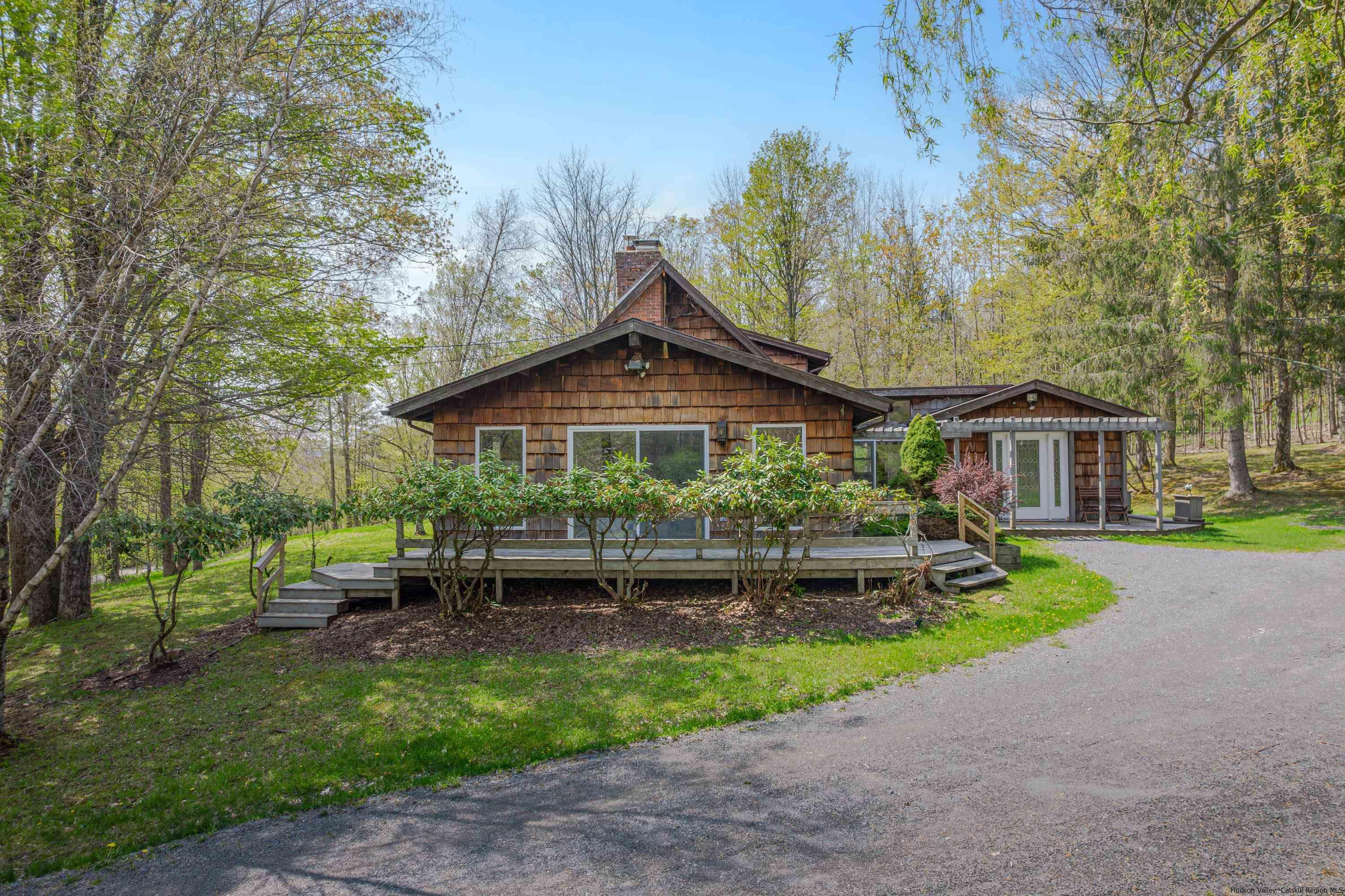 167 Old Towne Road Roxbury, NY 12421 - Photo 2 of 29 a front view of a house with a yard
