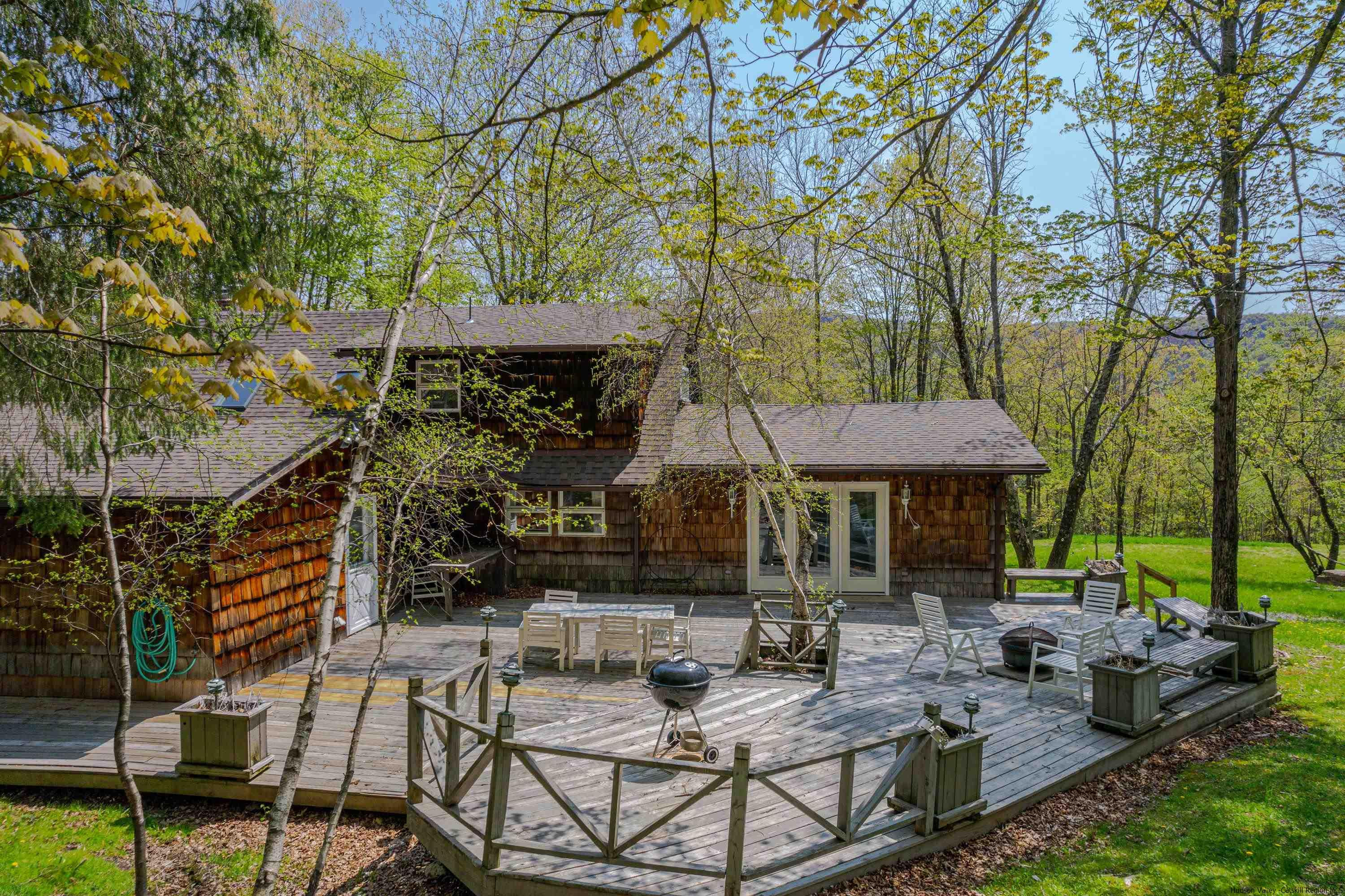 167 Old Towne Road Roxbury, NY 12421 - Photo 26 of 29 a view of a patio with table and chairs under an umbrella