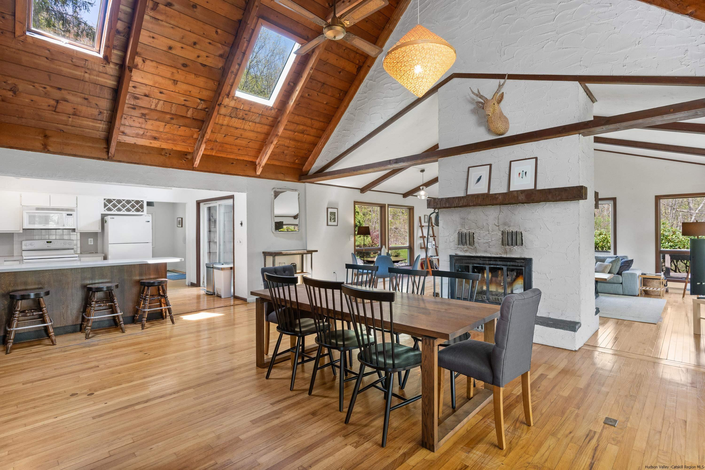 167 Old Towne Road Roxbury, NY 12421 - Photo 4 of 29 a view of a dining room with furniture and wooden floor
