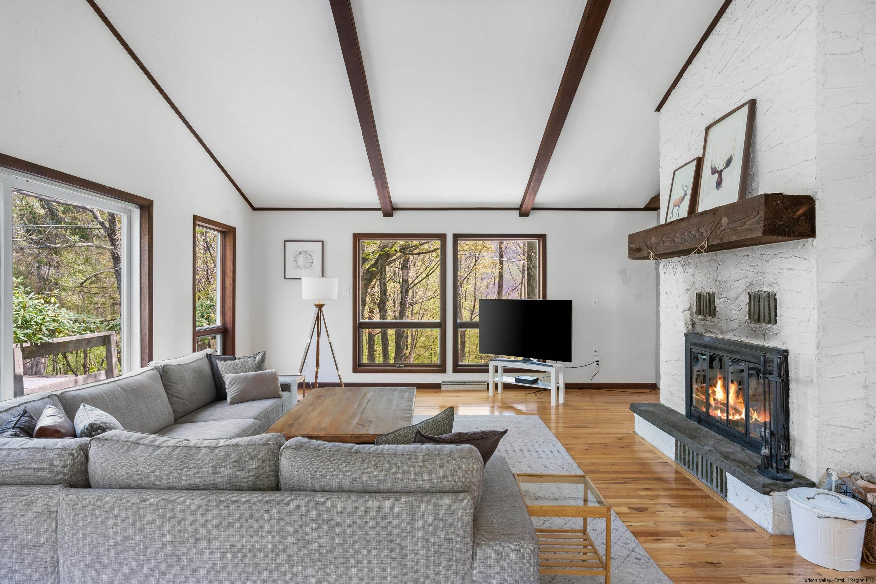 167 Old Towne Road Roxbury, NY 12421 - Photo 8 of 29 a living room with fireplace furniture and a flat screen tv