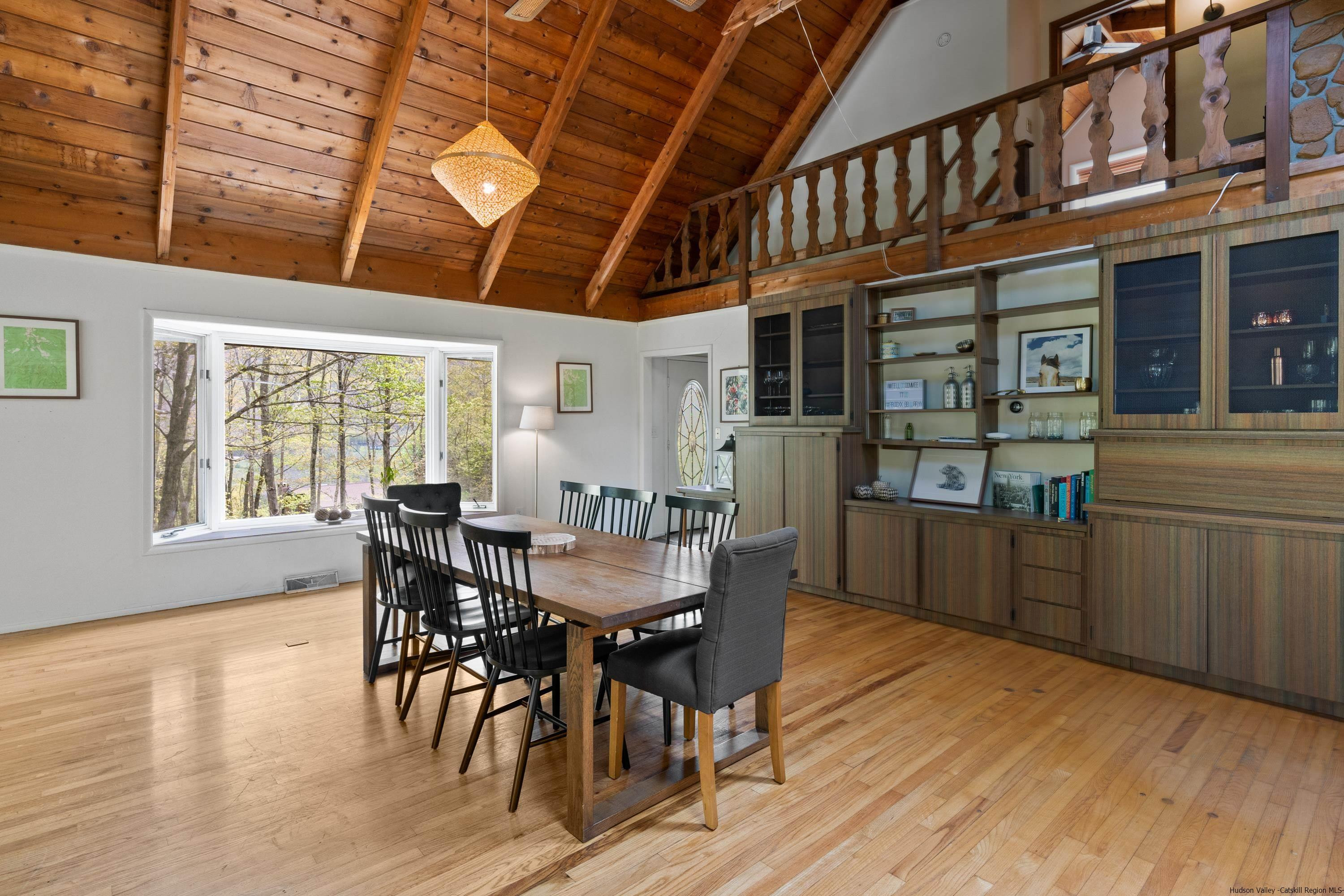 167 Old Towne Road Roxbury, NY 12421 - Photo 9 of 29 a view of a dining room with furniture and wooden floor