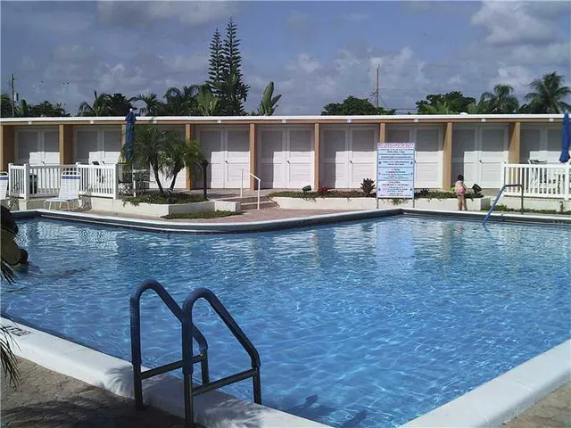 a view of swimming pool with outdoor seating