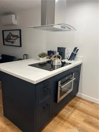 a kitchen with a stove and cabinets