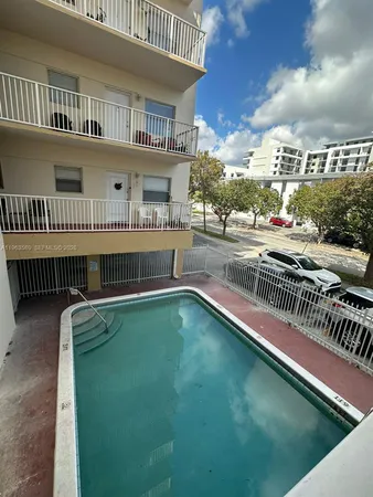 a view of a swimming pool and deck