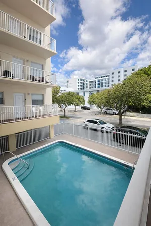a view of balcony with furniture