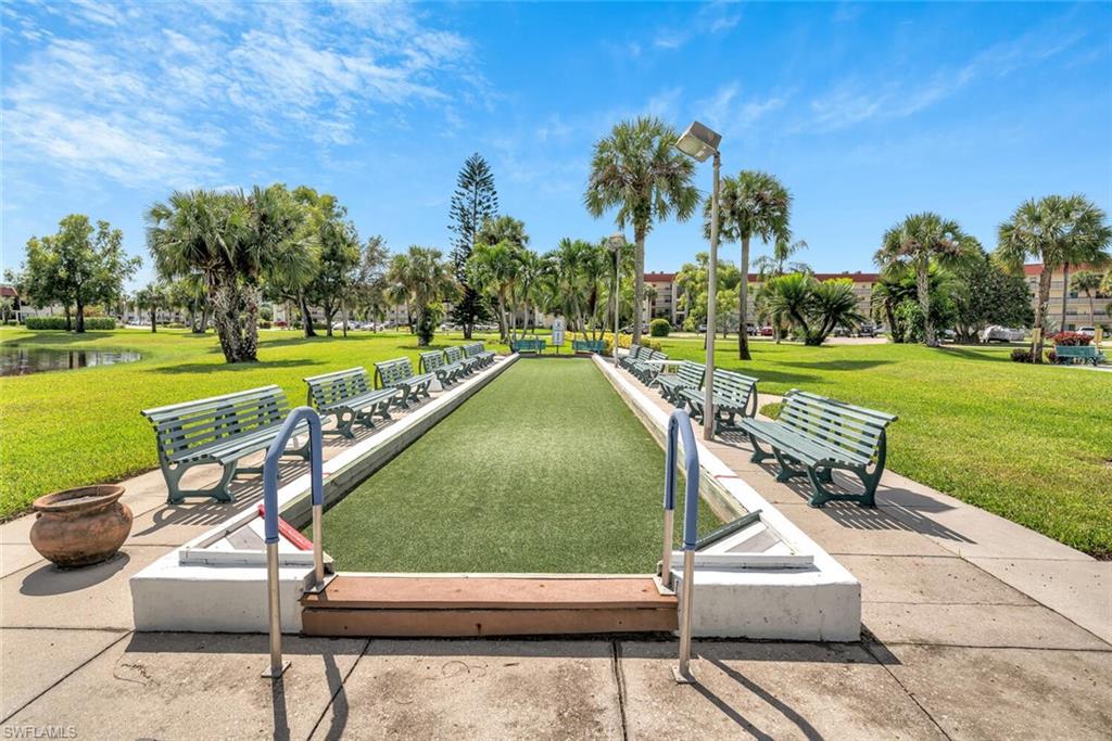 4258 27th Court Southwest, Unit 203 Naples, FL 34116 - Photo 13 of 15 View of property's community with a water view and a yard