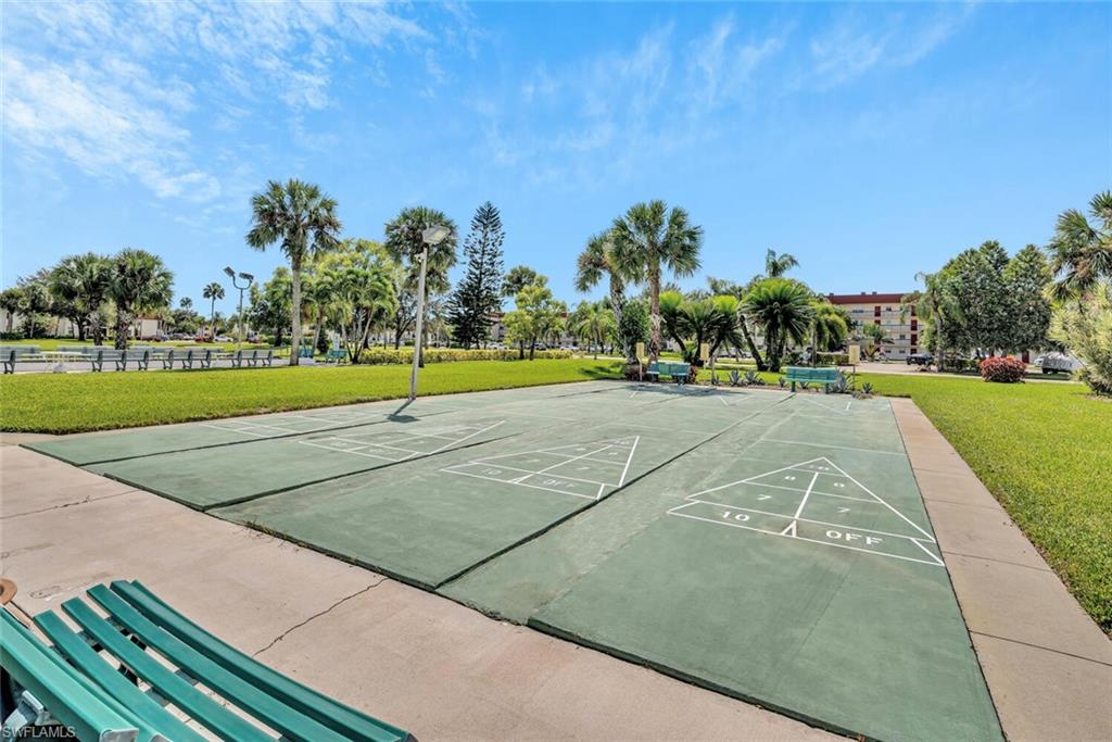4258 27th Court Southwest, Unit 203 Naples, FL 34116 - Photo 14 of 15 View of community featuring a lawn