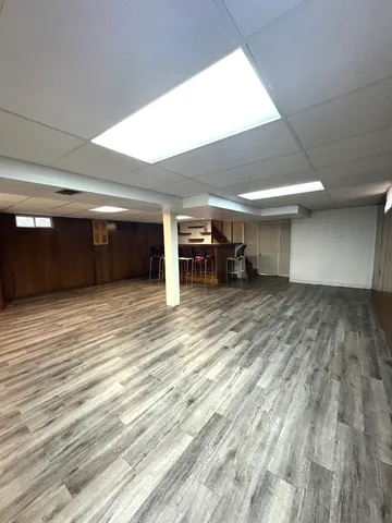 a view of a room with wooden floor