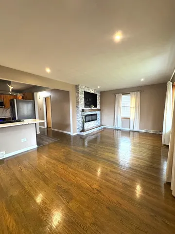 a large kitchen with a sink and cabinets