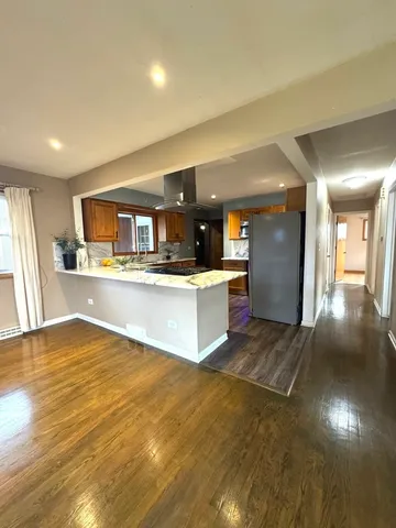 an empty room with a empty space and windows