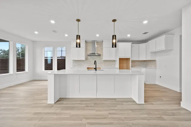 a view of kitchen with wooden floor and window