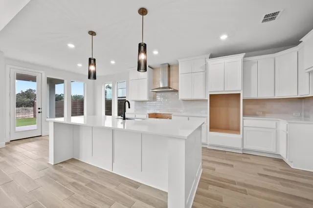 a kitchen with stainless steel appliances sink refrigerator and microwave