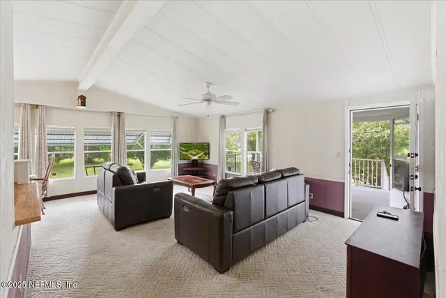 a kitchen with granite countertop a sink and refrigerator