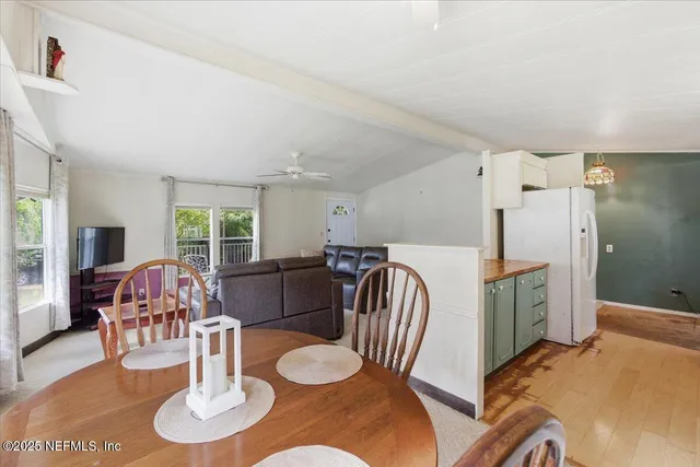 a bed room with a bed and a chair