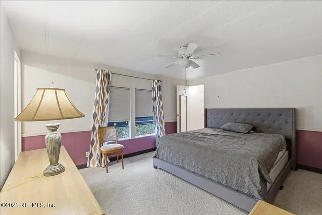 a bathroom with a toilet a sink and shower