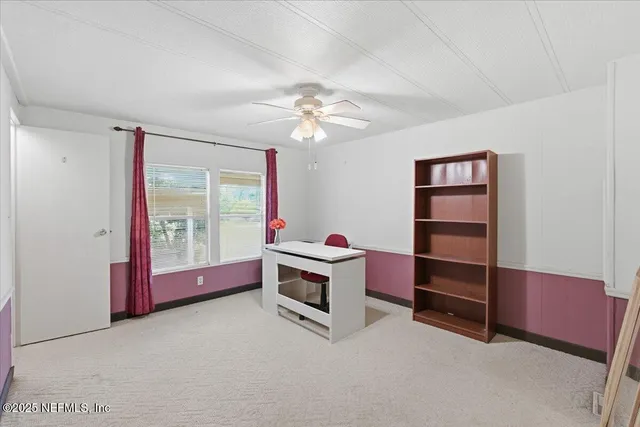a bathroom with a granite countertop sink a mirror and a shower