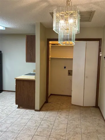a kitchen with a sink and a refrigerator