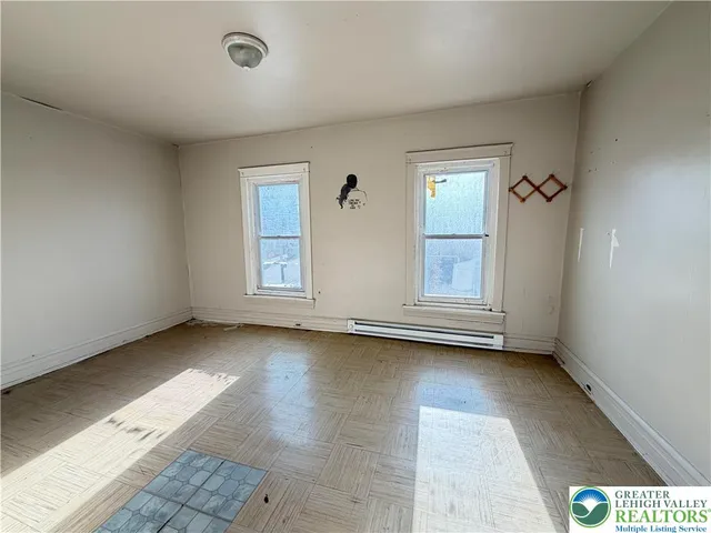 an empty room with windows