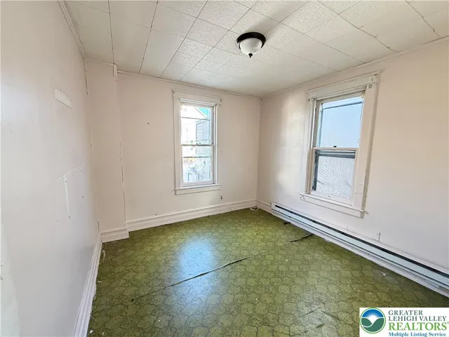 a view of an empty room with a window
