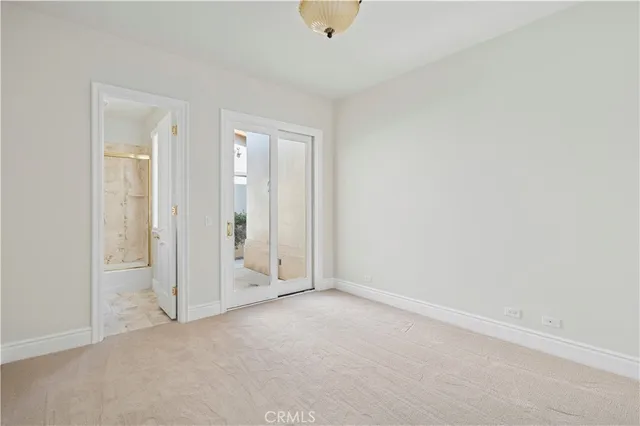 an empty room with closet area