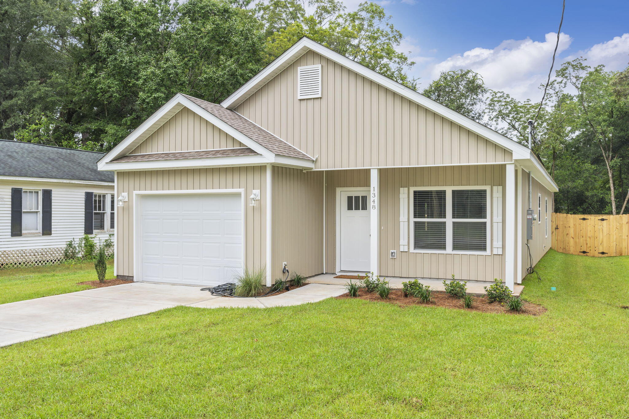 1357 East Chestnut Avenue Crestview, FL 32539 - Photo 1 of 37 a front view of a house with yard