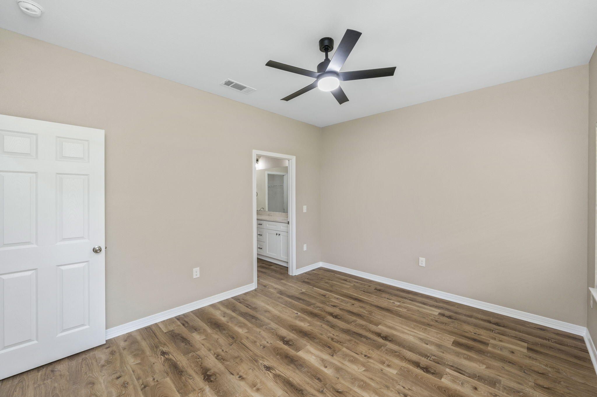 1357 East Chestnut Avenue Crestview, FL 32539 - Photo 19 of 37 wooden floor in an empty room