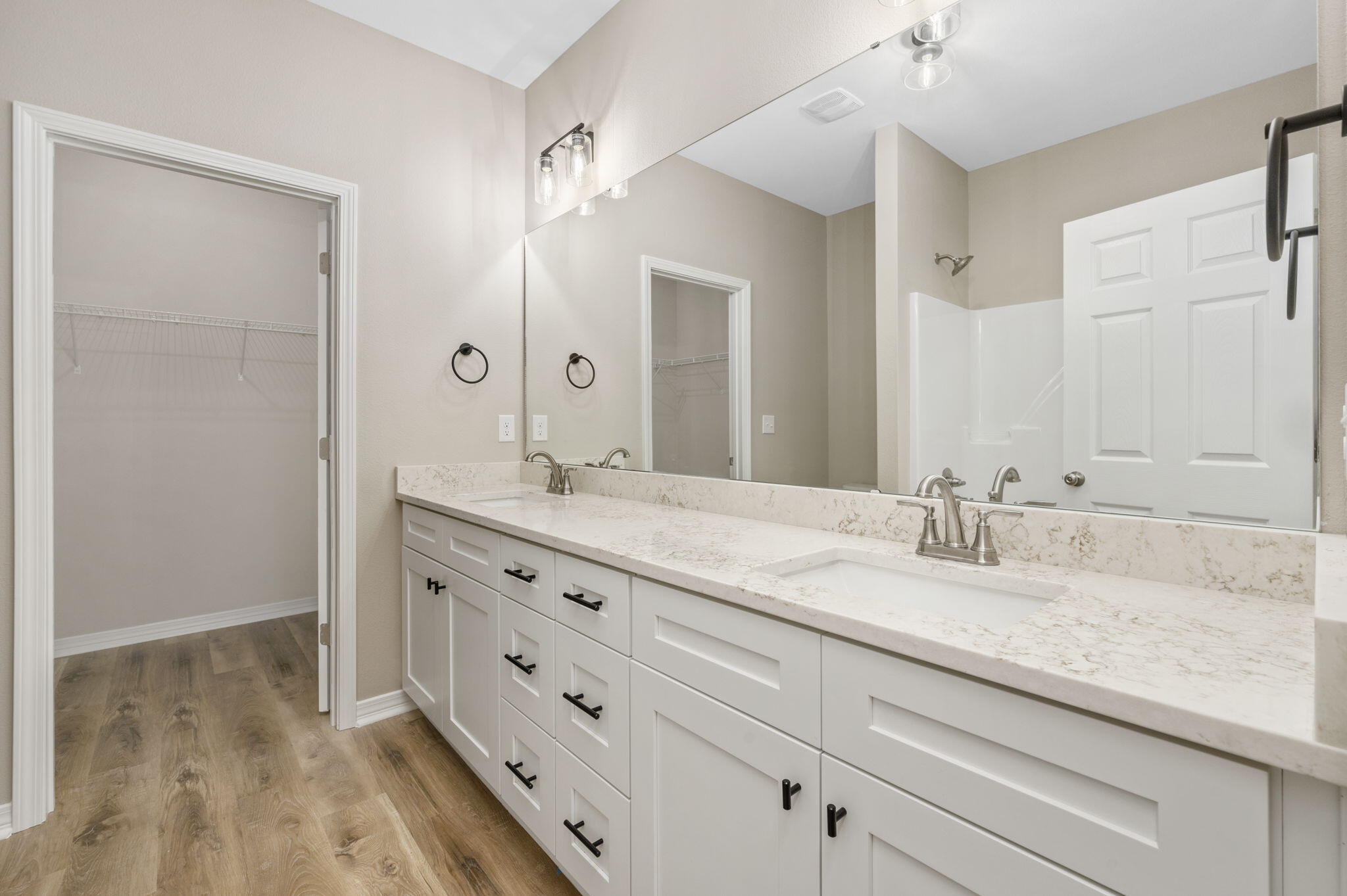 1357 East Chestnut Avenue Crestview, FL 32539 - Photo 22 of 37 a bathroom with double sink and a mirror