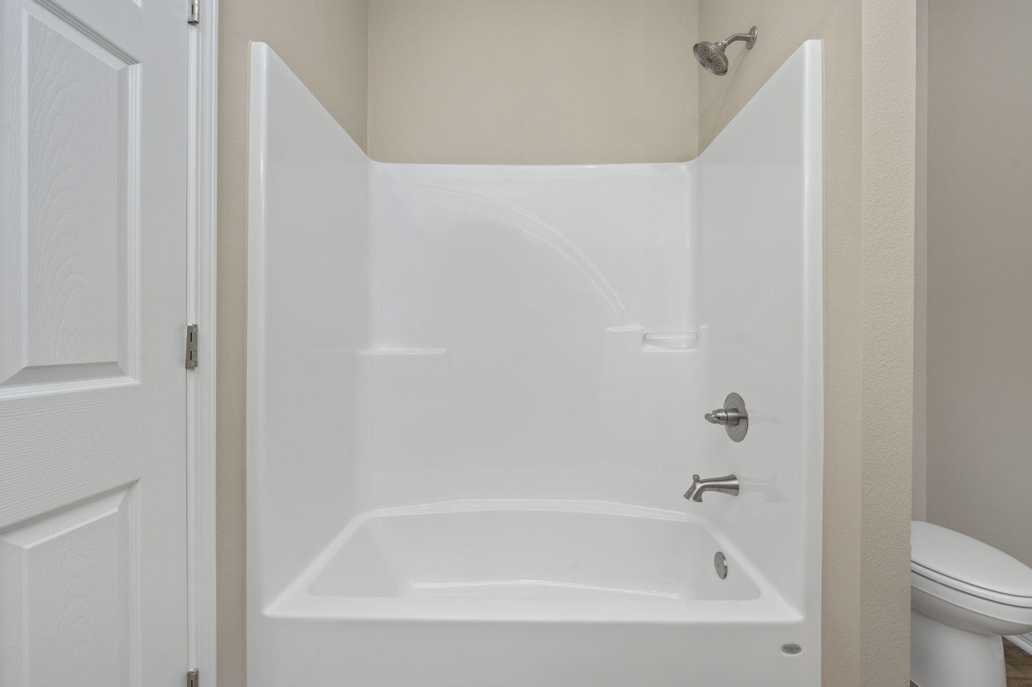 1357 East Chestnut Avenue Crestview, FL 32539 - Photo 24 of 37 a white bath tub sitting next to a white toilet