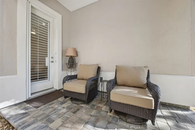 a bathroom with a granite countertop toilet a sink and a large mirror