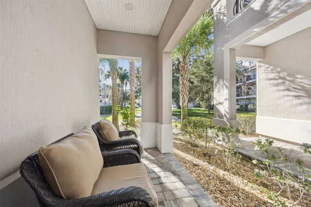 a living room with furniture and kitchen view