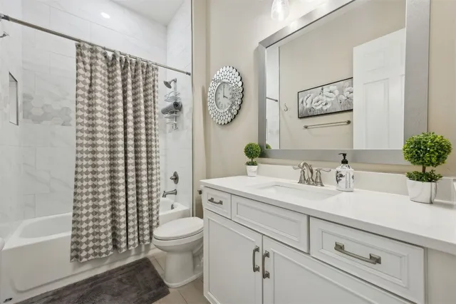 a balcony with couple of potted plants