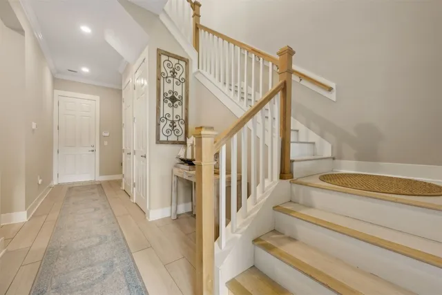 a front view of a house with a yard and parking space