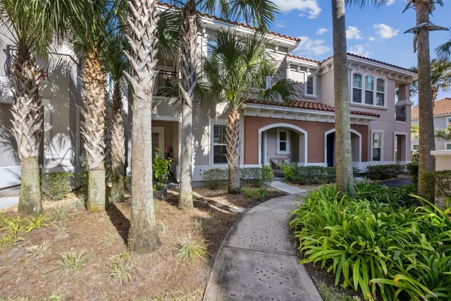 a view of staircase with white walls and a window