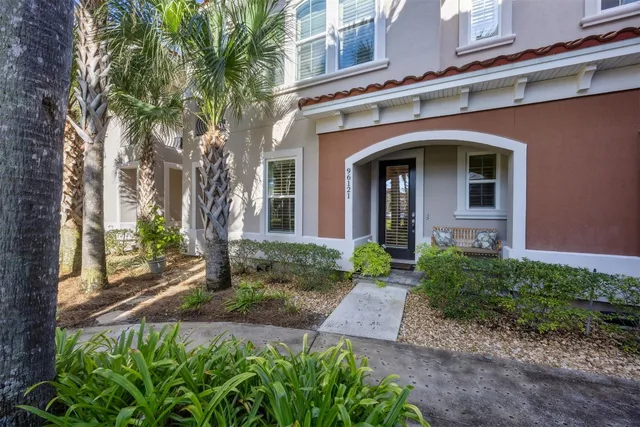 a large white bed in a white room