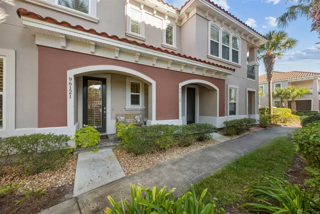 a bedroom with a bed and a ceiling fan